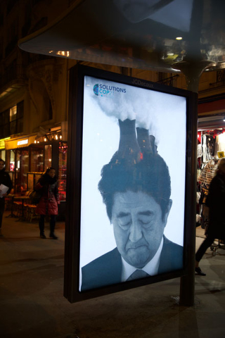 Illustration for article titled Paris Is Covered In Fake Ads That Mock the Climate Talks' Corporate Sponsors